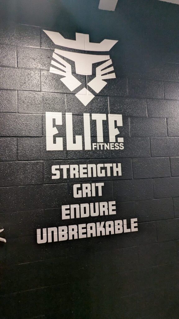 Elite Fitness - Wall Decal Vertical Elite White Logo on Wall